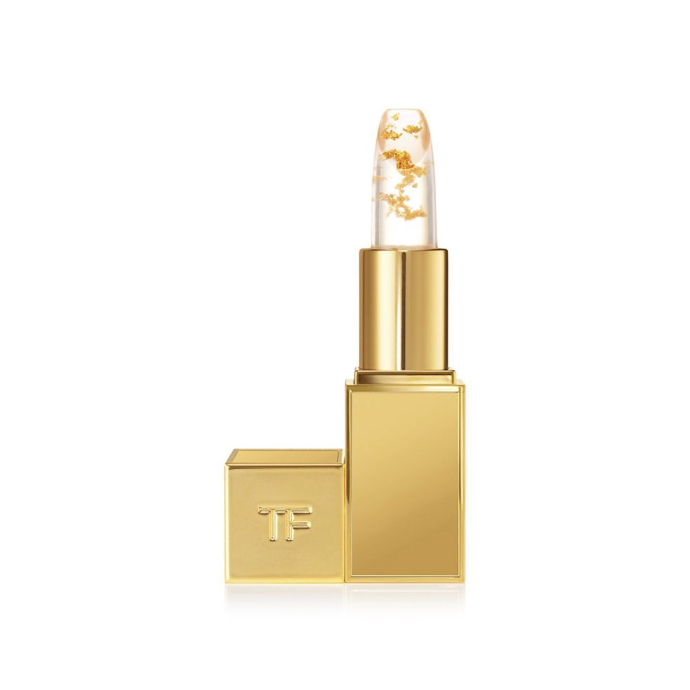 Close-up of Tom Ford Soleil Lip Blush Moisturising Balm, showing the product with a clear view of the golden packaging and the balm inside.