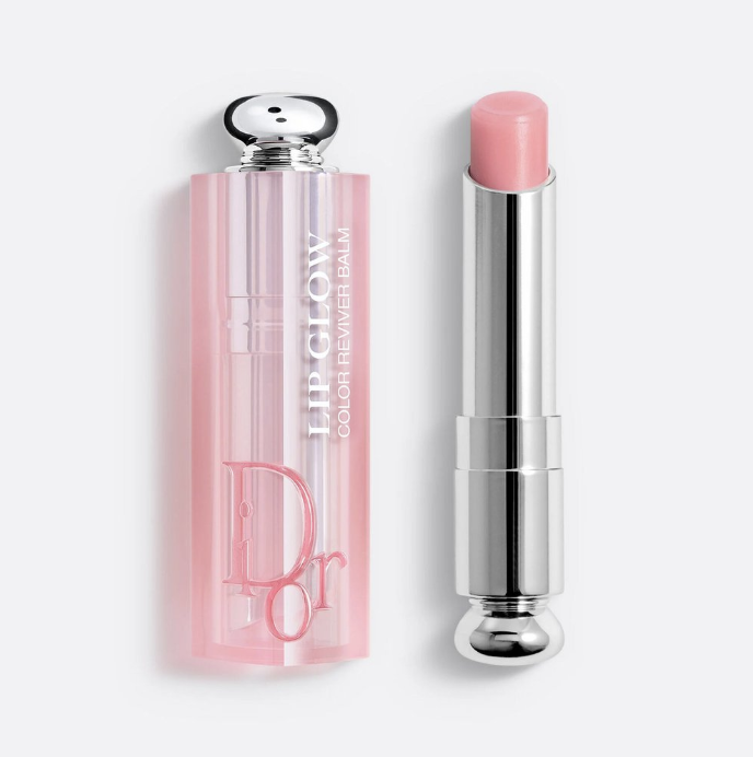 Close-up of Dior Addict Lip Glow Colour Reviver Balm, showing the pink transparent case with the silver applicator and the balm inside.